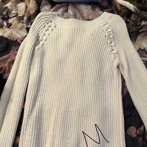 White sweater with braided detail